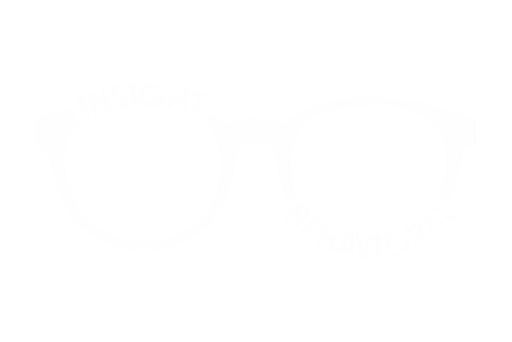 Logo of Insight Behavioral, displaying the text 'INSIGHT' on the left lens and 'BEHAVIORAL' on the right lens of a pair of eyeglasses.